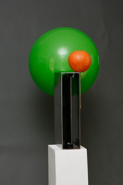 Metal sculpture with green ball